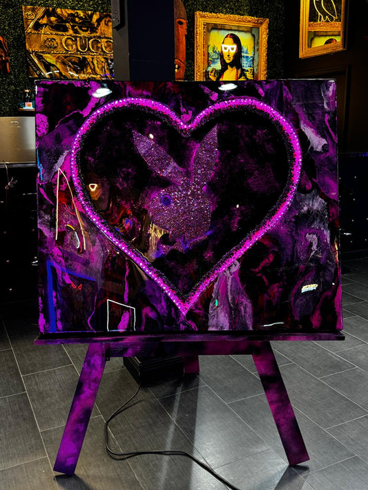 High-gloss epoxy artwork featuring a Swarovski crystal-embellished playboy emblem in pink