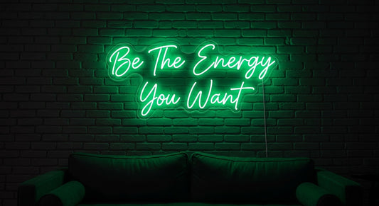 Be The Energy You Want Neon Sign - green neon on brick background