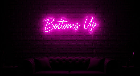 Bottoms Up Neon Sign - pink neon on brick background