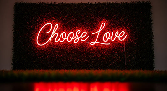 Choose Love Neon Sign - red neon on grass background