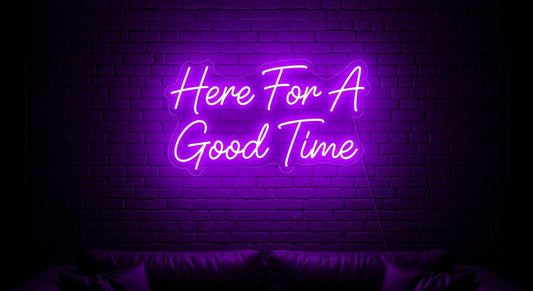 Here For A Good Time Neon Sign - purple neon on brick background