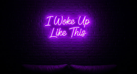 I Woke Up Like This Neon Sign - purple neon on brick background