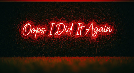 Oops I Did It Again Neon Sign - red neon on grass background