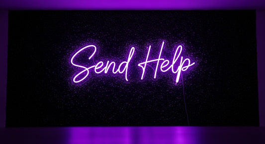 Send Help Neon Sign - purple neon on grass background