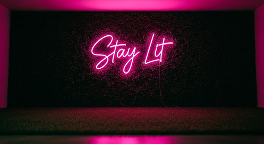Stay Lit Neon Sign - pink neon on grass background