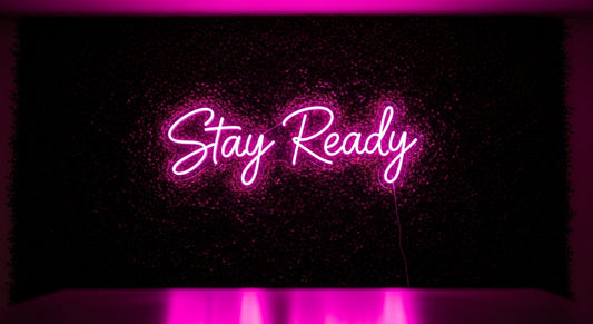 Stay Ready Neon Sign - pink neon on grass background