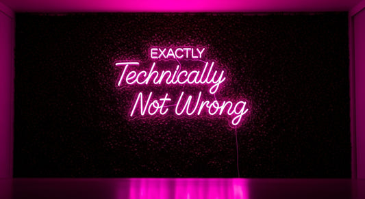 Technically Not Wrong Neon Sign - pink neon on grass background